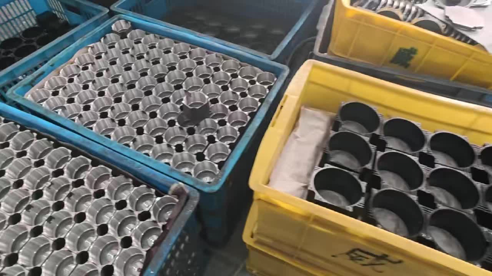 Trays of machined motor housings ready for stator winding
